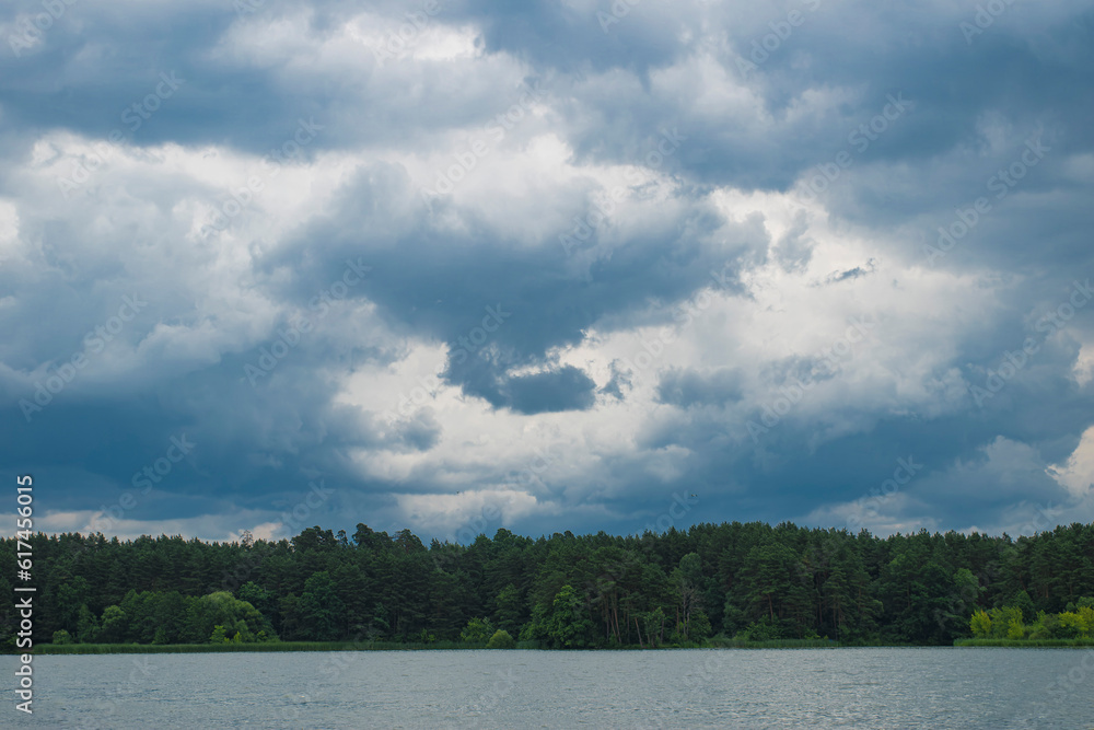 Cloudy sky over lake before rain Cloudy sky over lake before rain