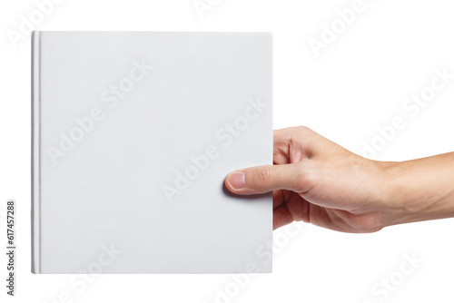 Hand holding a blank hard cover square book, cut out photo
