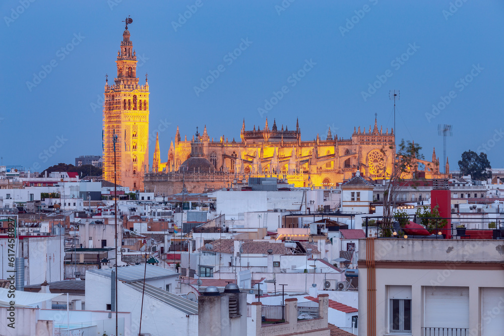 Seville Cathedral and the Giralda tower in night illumination. Seville. Spain. Andalusia. Seville Cathedral and the Giralda tower in night illumination. Seville. Spain. Andalusia.
