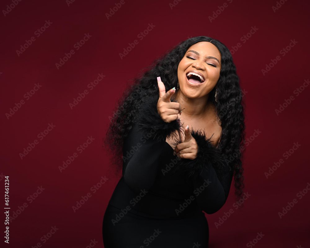 Photo of satisfied glad woman raise fists closed eyes open mouth scream yeah isolated on red color background Photo of satisfied glad woman raise fists closed eyes open mouth scream yeah isolated on red color background