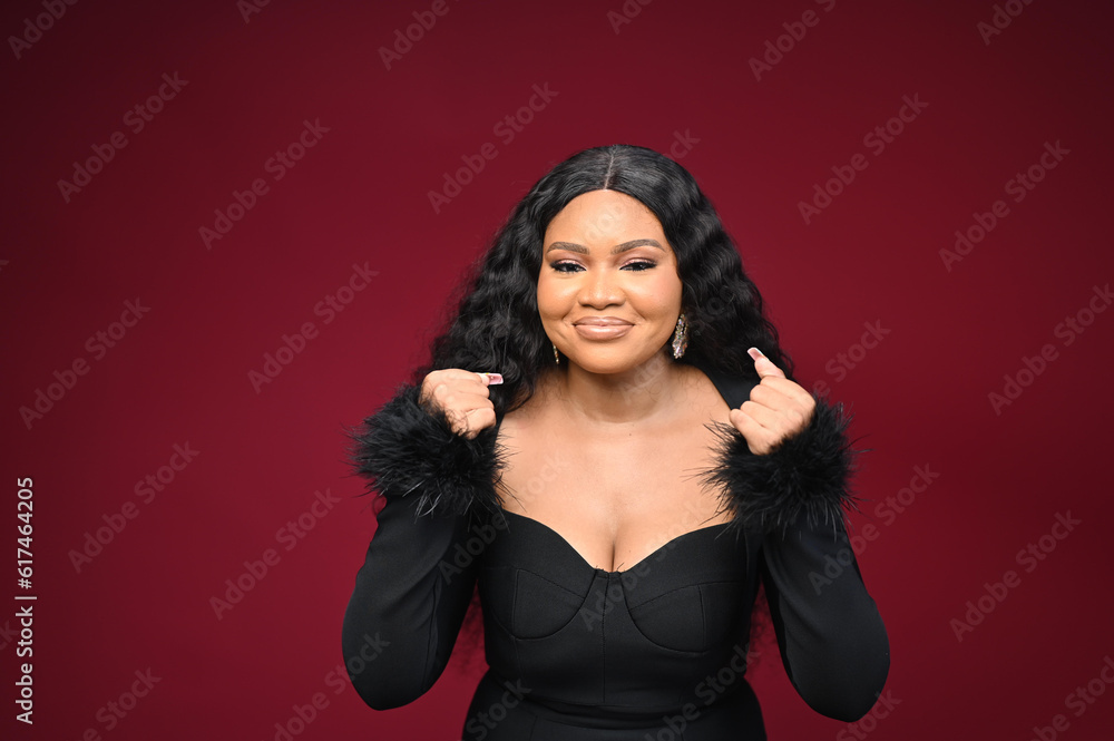 Young woman with smartphone waiting for a call on smartphone elegant black gown on an isolatable red background Young woman with smartphone waiting for a call on smartphone elegant black gown on an isolatable red background