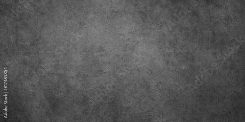 Abstract old stained and dusty Panorama dark grey black slate wall or Black texture chalkboard and blackboard with center in black with high resolution used as wallpaper, cover, decoration and design.