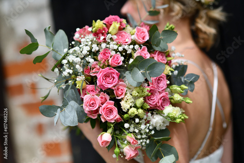 Pretty bridal wedding bouquet being held by a bride