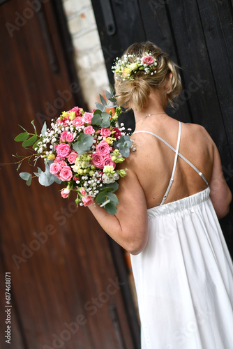 Young girl with a bouquet of roses