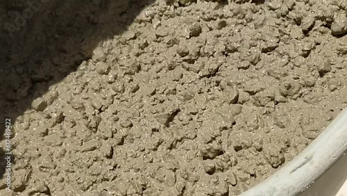 Powerful Mixing: Close Up of Cement Mixer Mixing Concrete.