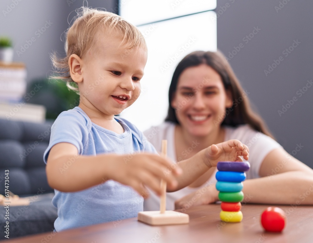 Mother and son smiling confident playing at home Mother and son smiling confident playing at home
