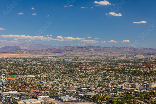 Beautiful aerial view of Las Vegas with mountain landscape on blue sky with white clouds background. USA.