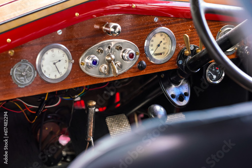 Speedometer on vintage red car, closeup detail