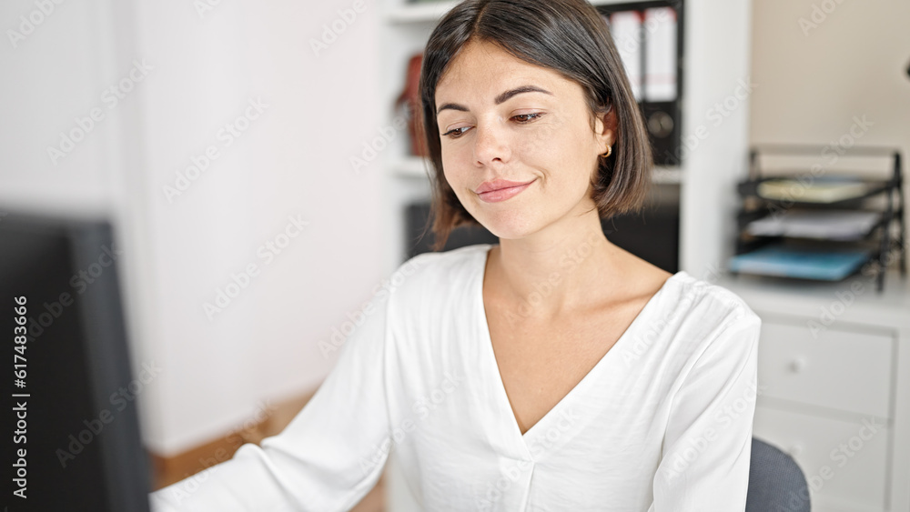 Young beautiful hispanic woman business worker using computer working at office Young beautiful hispanic woman business worker using computer working at office