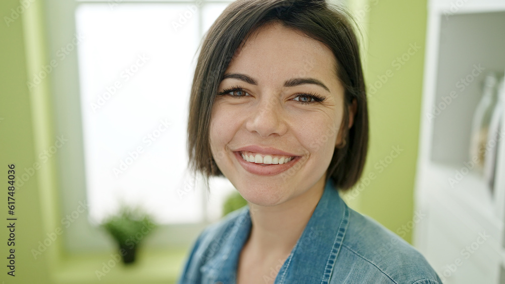 Young caucasian woman smiling confident sitting on table at home Young caucasian woman smiling confident sitting on table at home
