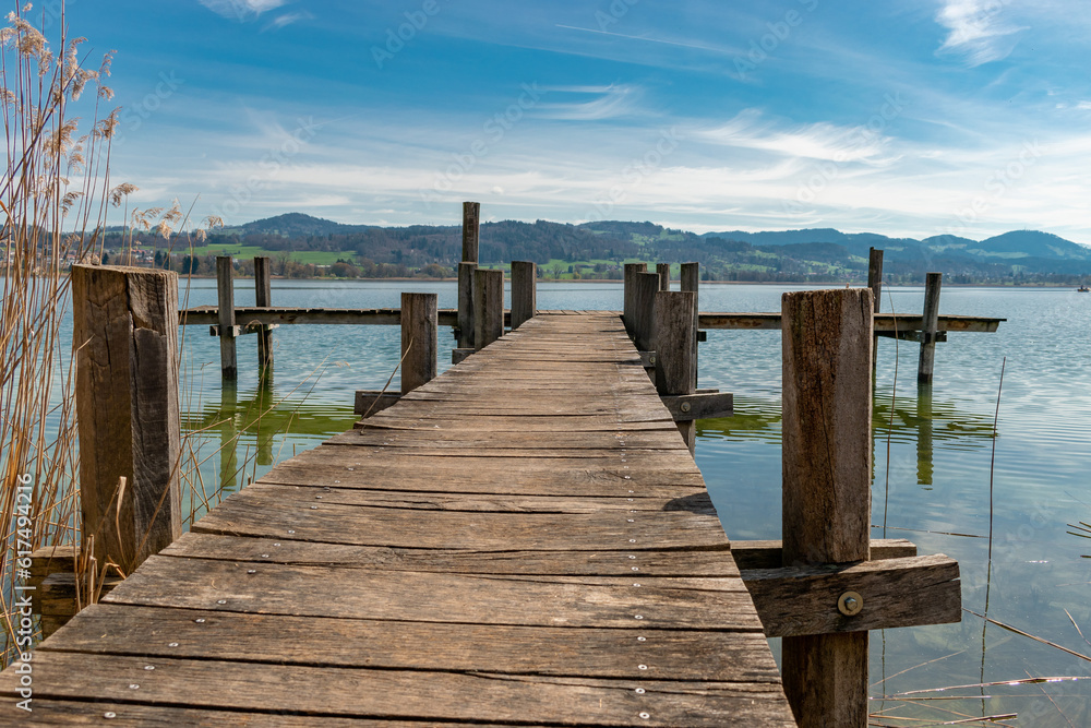 Fototapeta premium Small pier at the lake Pfaeffikersee in Zurich in Switzerland