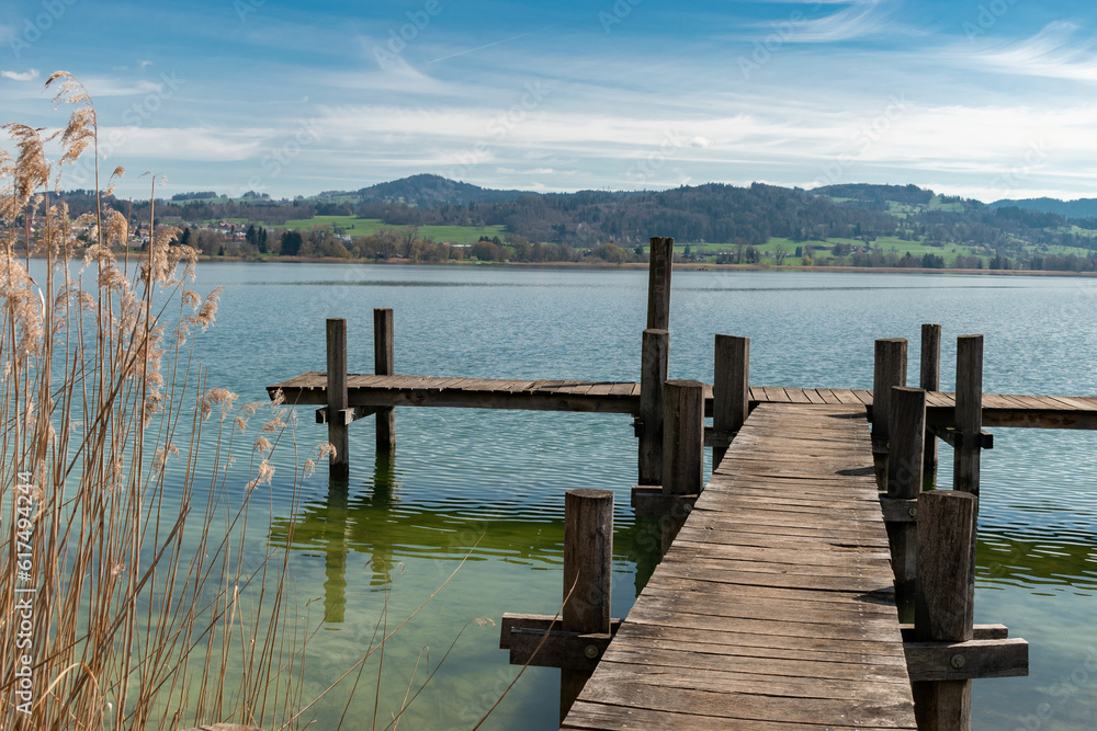 Naklejka premium Small pier at the lake Pfaeffikersee in Zurich in Switzerland