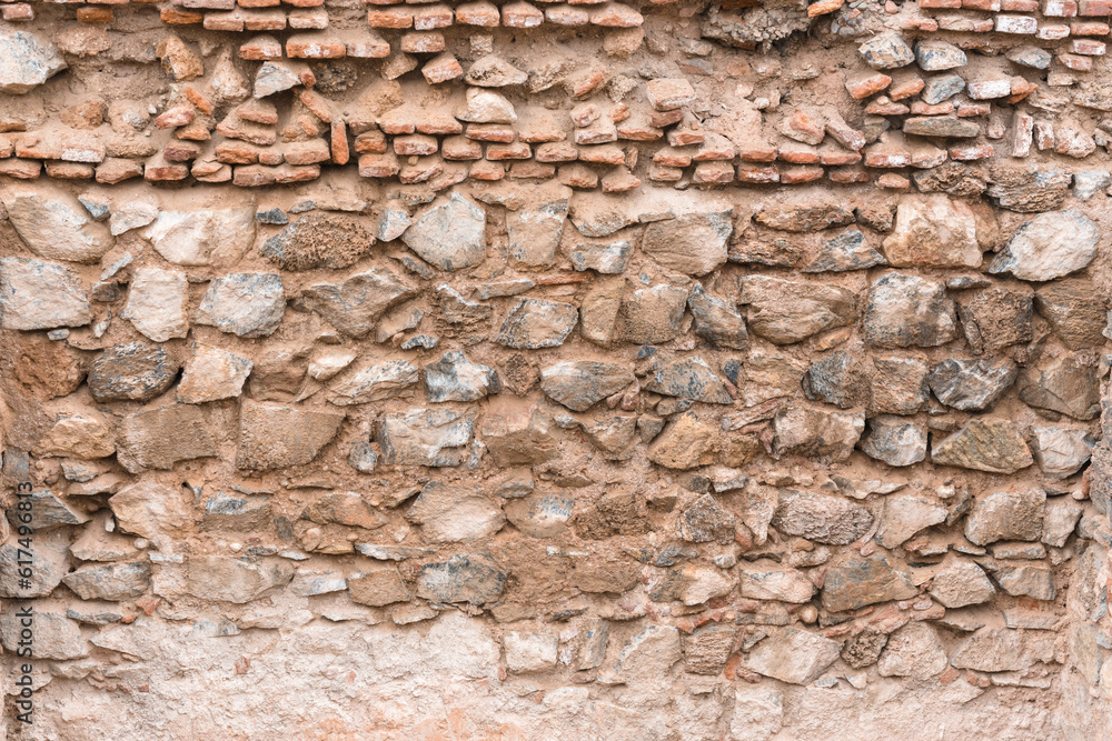 Struktur an einem Bauwerk, Natursteinmauer mit Lehm in Marrakesch, Marokko Struktur an einem Bauwerk, Natursteinmauer mit Lehm in Marrakesch, Marokko