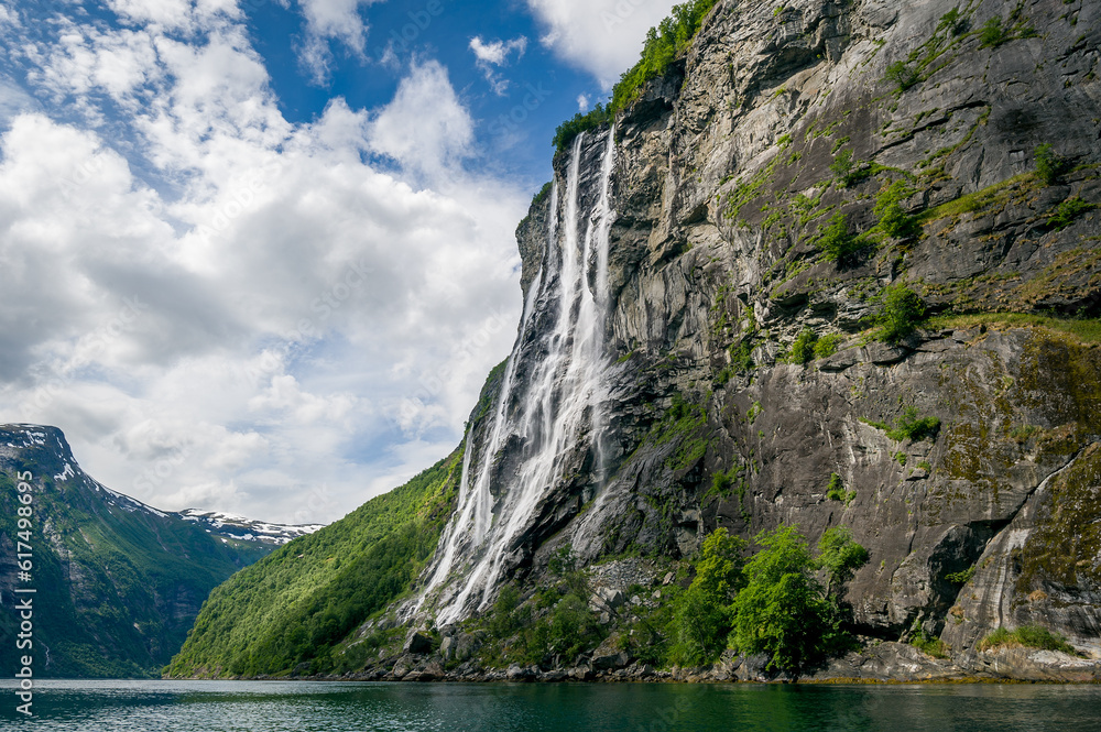 Geiranger fjord famous waterfalls, accessible only from water. Popular kayak trip destination. Geirangerfjord, Norway. Geiranger fjord famous waterfalls, accessible only from water. Popular kayak trip destination. Geirangerfjord, Norway.