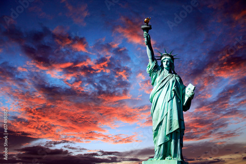 Statue of Liberty on Liberty Island in New York City. Isolated on sunset