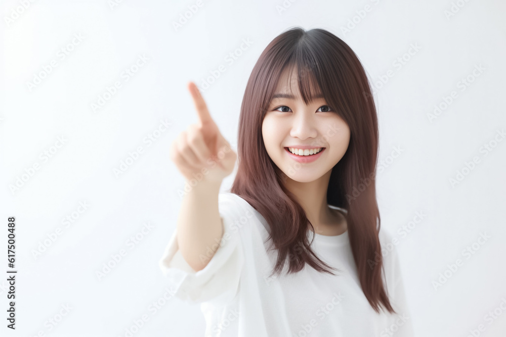 Pointing finger of an Asian girl highlights vacant space on a white background, making it a prime choice for a promotional advertising banner. Generative AI. Pointing finger of an Asian girl highlights vacant space on a white background, making it a prime choice for a promotional advertising banner. Generative AI.