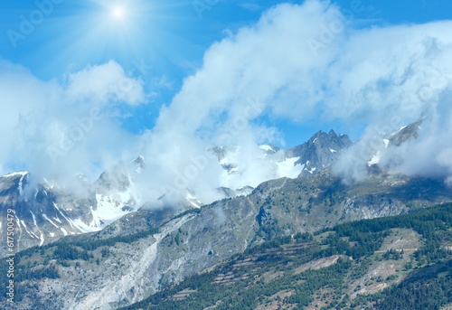 Summer mountain sunshiny landscape with snow on mount top   Alps  Switzerland 