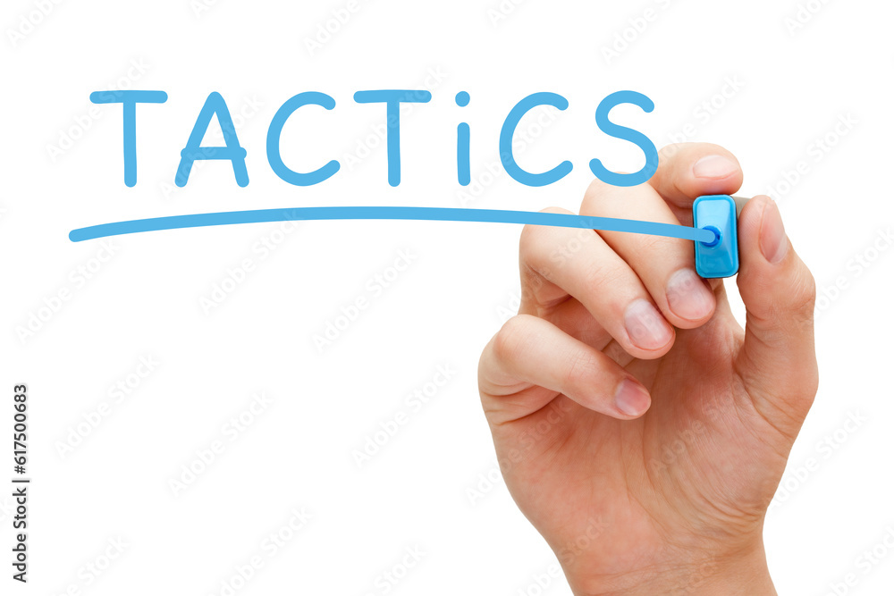 Hand writing Tactics with blue marker on transparent wipe board. Hand writing Tactics with blue marker on transparent wipe board.