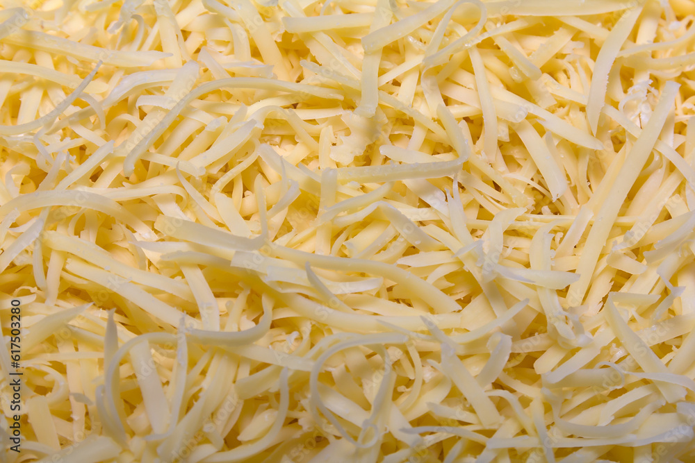 Heap of Grated pizza cheese close up texture Heap of Grated pizza cheese close up texture