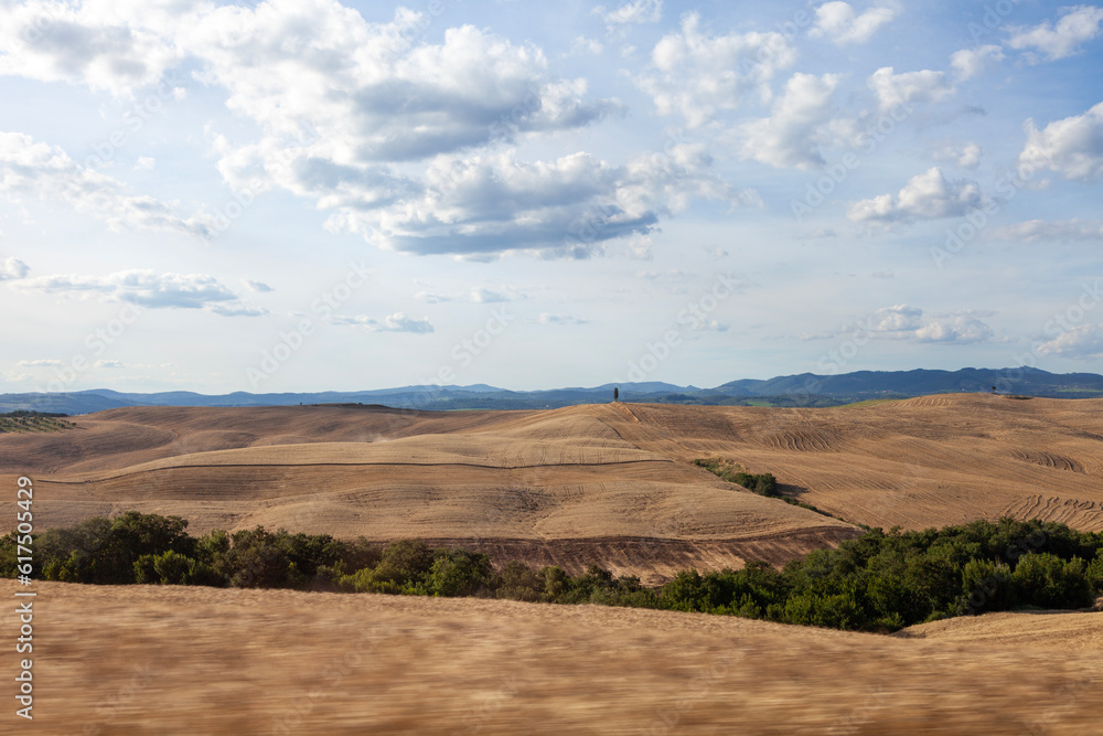 Summer Tuscany landscape with wheat fields. Concept agriculture. Italy, Europe.