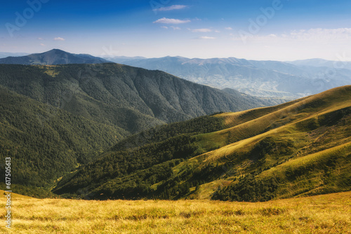 Amazing landscape scenic mountains in summer. View of light and afternoon shadow over hills and clear blue sky.