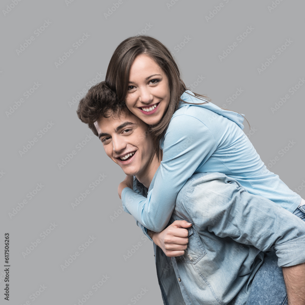 Smiling young couple having fun together and piggybacking Smiling young couple having fun together and piggybacking