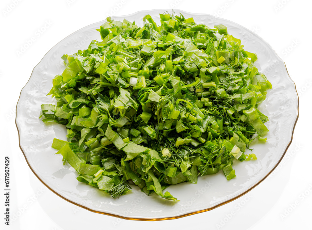 Porcelain plate with gold edges, filled with chopped greens. Prepared especially for soup or salad. Porcelain plate with gold edges, filled with chopped greens. Prepared especially for soup or salad.