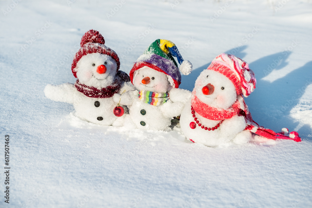 Happy snowman family with hats n the snow
