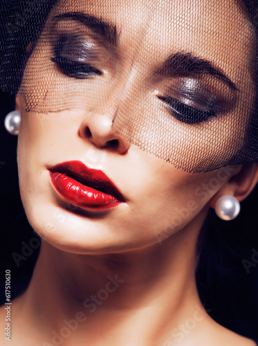 beauty brunette woman under black veil with red manicure close up, grieving widow, halloween makeup