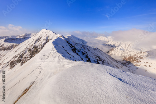 The Moldoveanu Peak in winter. Fagaras Mountains, Romania © Designpics