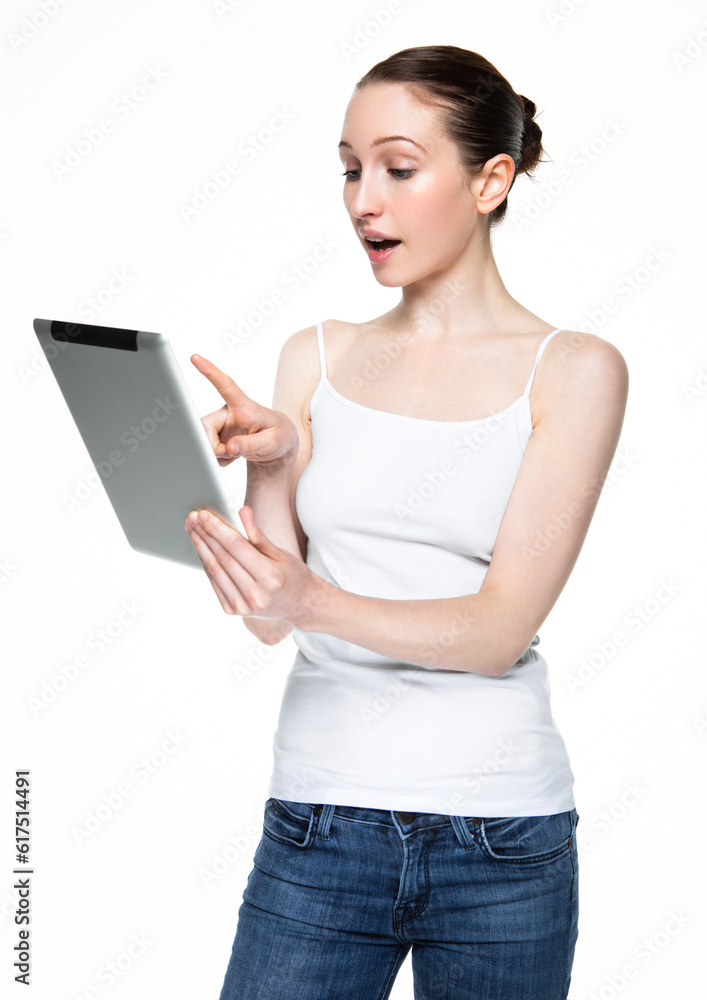 Beautiful woman browsing internet on tablet on white background Beautiful woman browsing internet on tablet on white background