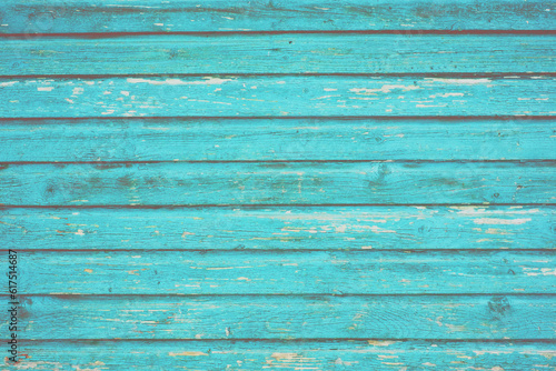 Section of turquoise blue wood panelling from a seaside beach hut. Perfect as a background for Summer Holiday or seaside themes.
