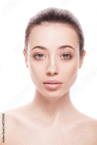 closeup portrait of young woman with clean fresh skin isolated on white background