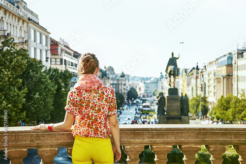 The spirit of old Europe in Prague. Seen from behind modern woman on Vaclavske namesti in Prague, Czech Republic looking photo