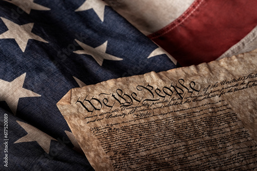 Obraz na plátně U.S. constitution on an old and worn flag
