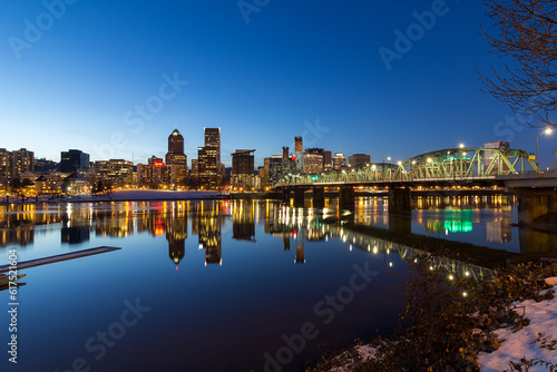 Portland Oregon downtown skyline along Willamette River winter night scene