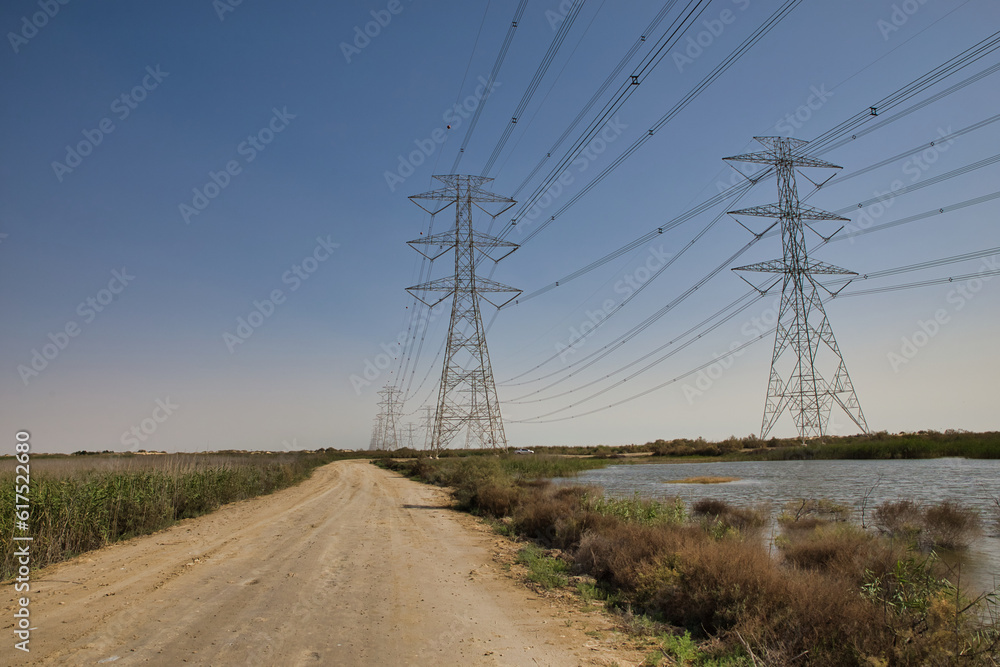 High Power Electric transmission grid lines in the desert.Dammam -Saudi Arabia.