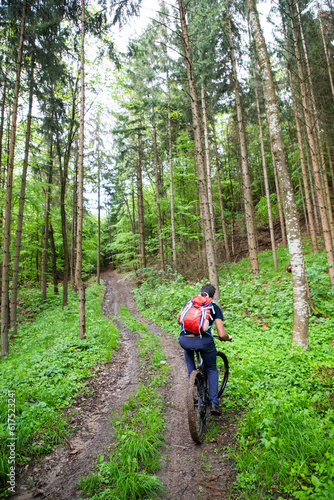 man on a mountain bike in the forest