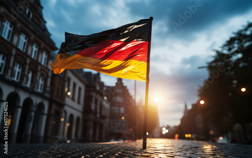 German flag waving against a blue sky