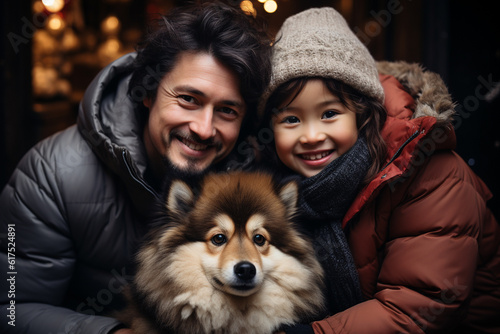 Portrait of a father with his daughter and dog at Christmas