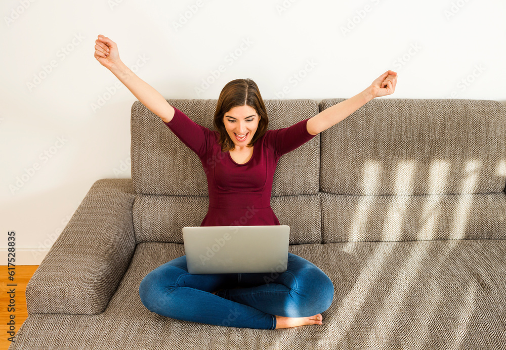 Beautiful woman working from the confort of home with her laptop Beautiful woman working from the confort of home with her laptop