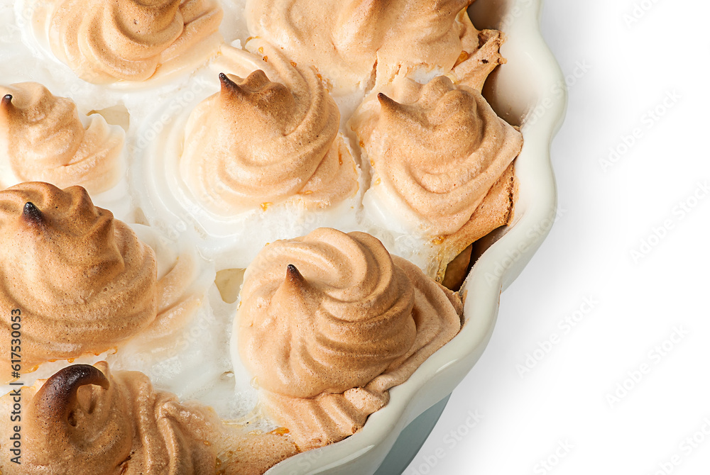 Closeup lemon pie with meringue on dish isolated on white background Closeup lemon pie with meringue on dish isolated on white background