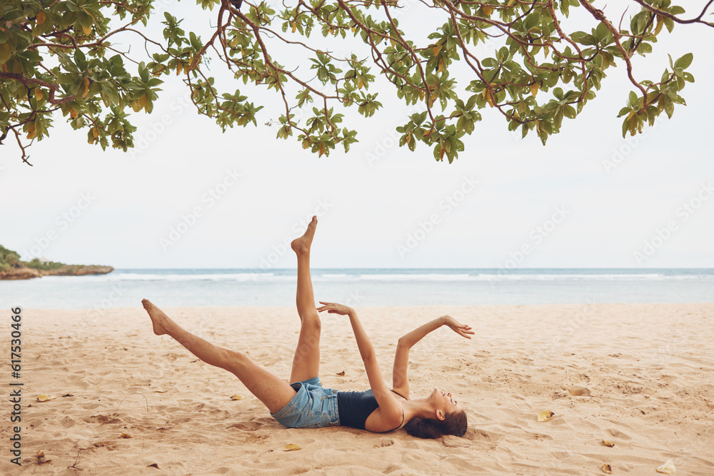 sand woman beach sitting freedom sea vacation nature smile ocean travel