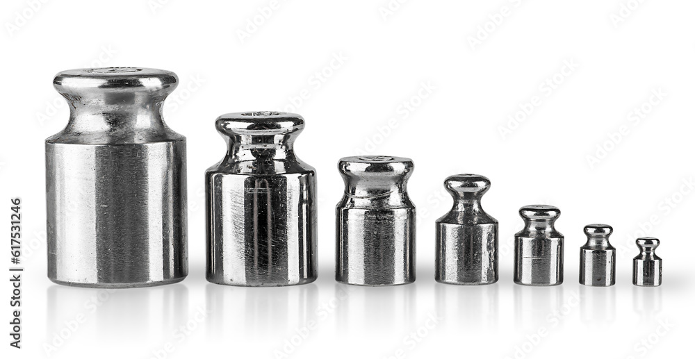 Old worn measuring weights in a row isolated on white background Old worn measuring weights in a row isolated on white background