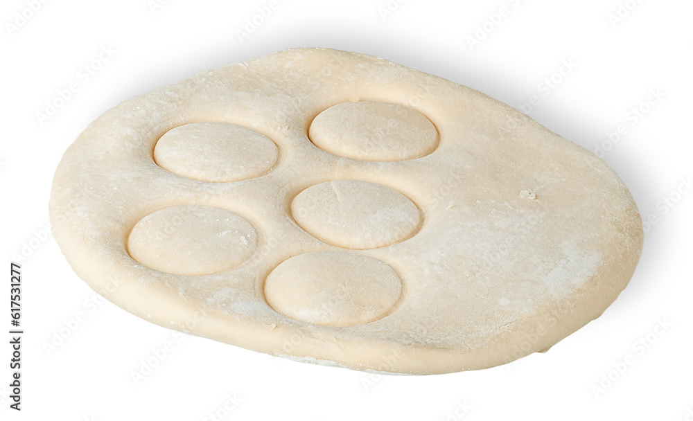 Roll dough with pressed through circles isolated on white background Roll dough with pressed through circles isolated on white background