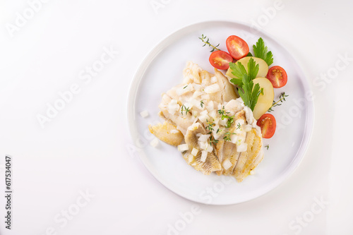 White fish on a plate. Beautifully served fish on a plate with vegetables and spices. High quality photo photo