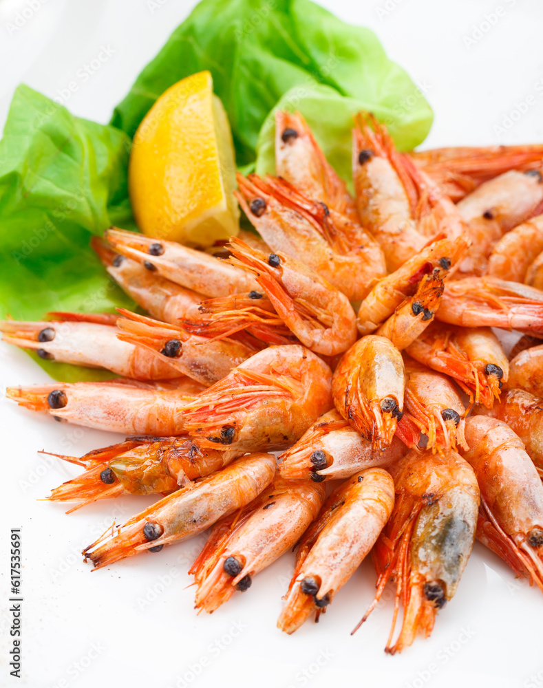Fried shrimps on a plate with lemon Fried shrimps on a plate with lemon
