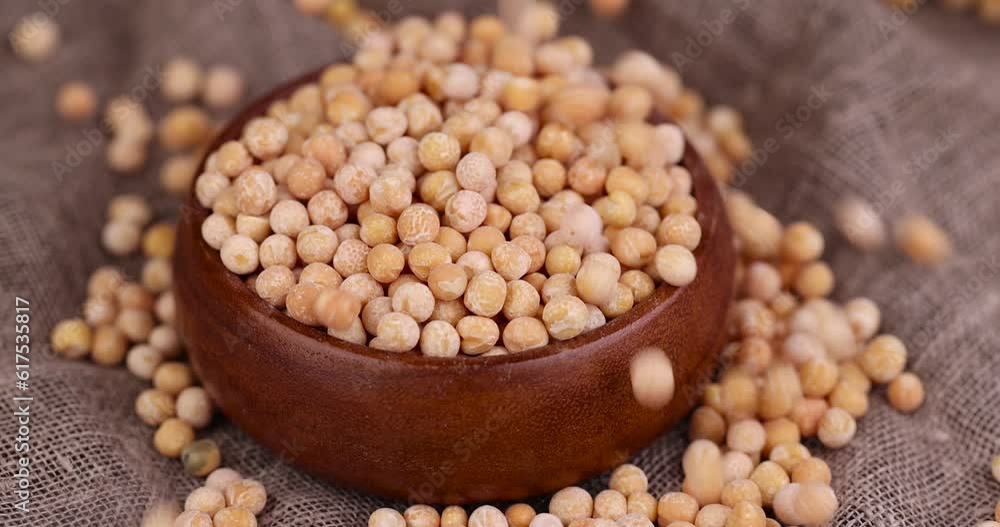 pour dry hard yellow peas for cooking porridge, dry yellow peas scattered before cooking pour dry hard yellow peas for cooking porridge, dry yellow peas scattered before cooking
