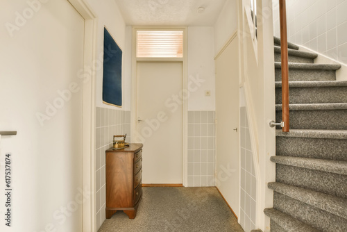 a hallway with stairs and tiled walls in an apartment building, london, uk - stock pictures & royalty illustrations
