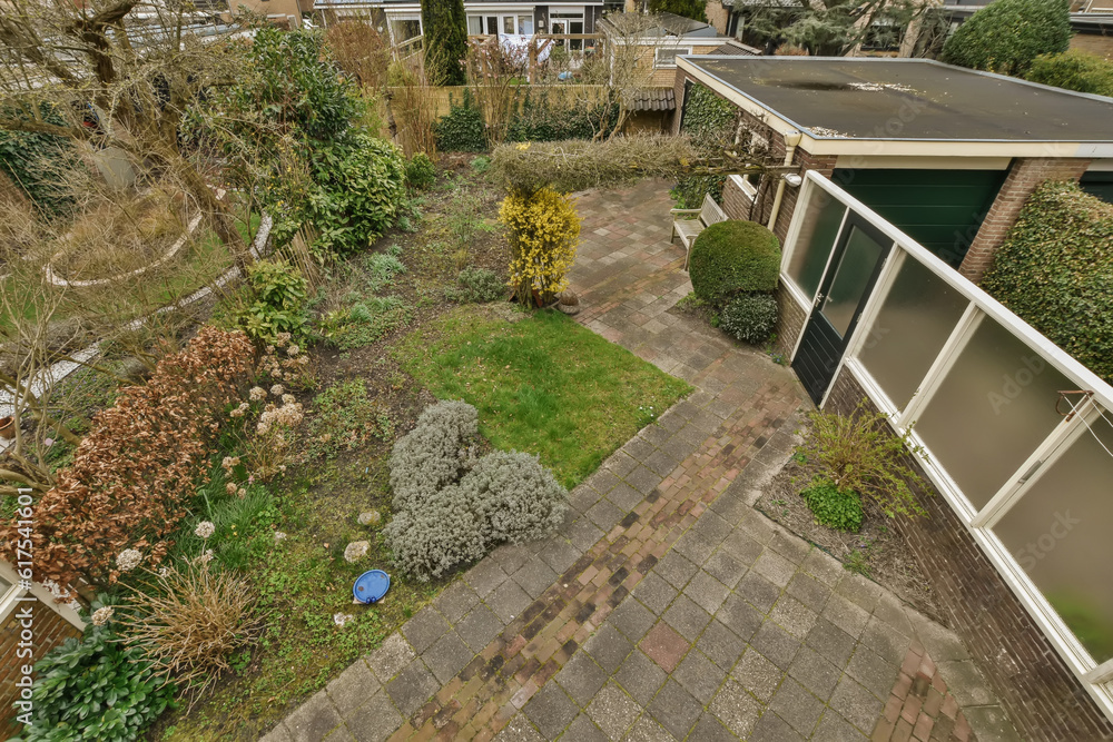 the back garden from above, with some plants and shrubs in the fore - image is taken from an aerial view the back garden from above, with some plants and shrubs in the fore - image is taken from an aerial view